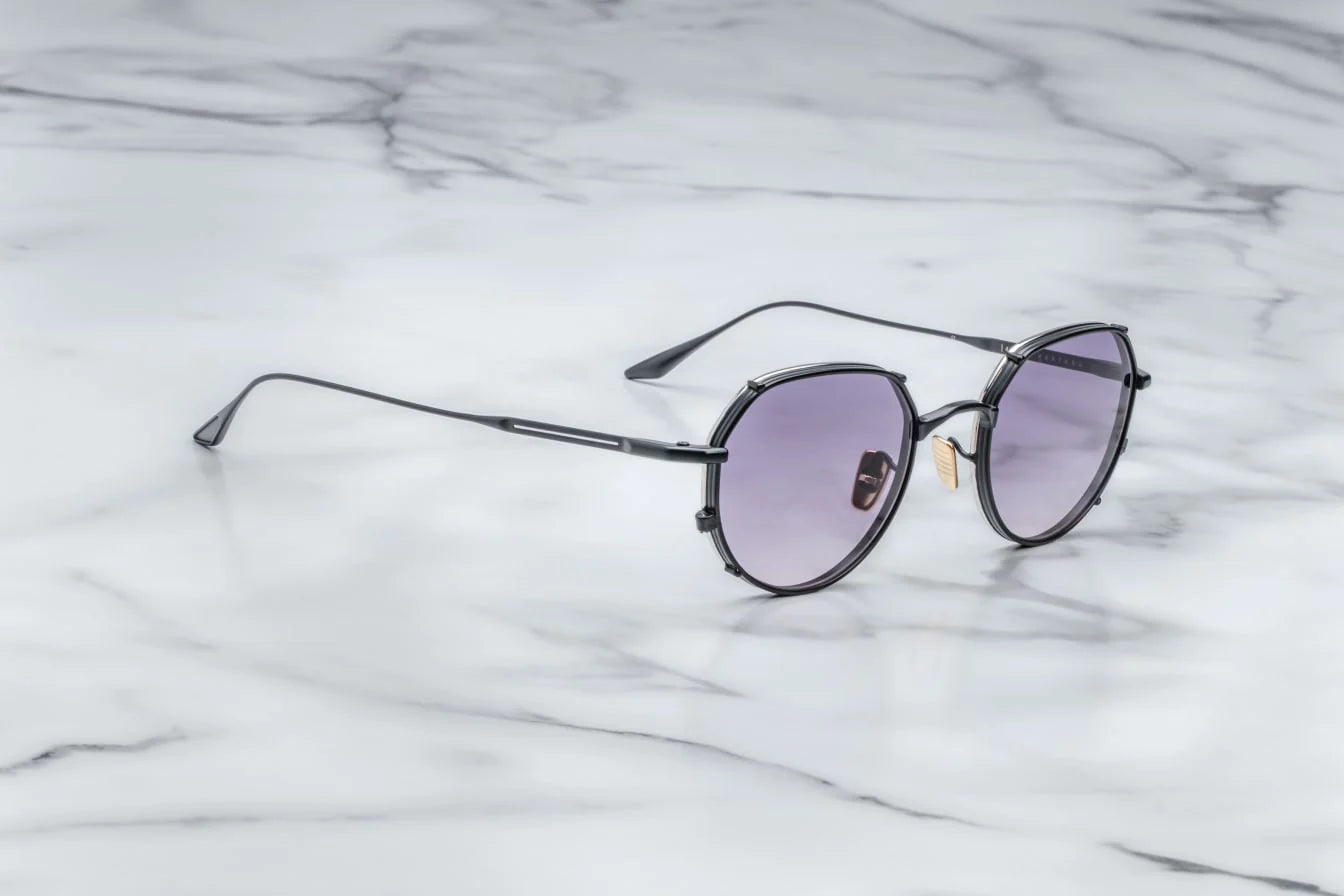 Jacques Marie Mage Hartana sunglasses in Blackberry (matte black with purple lenses).