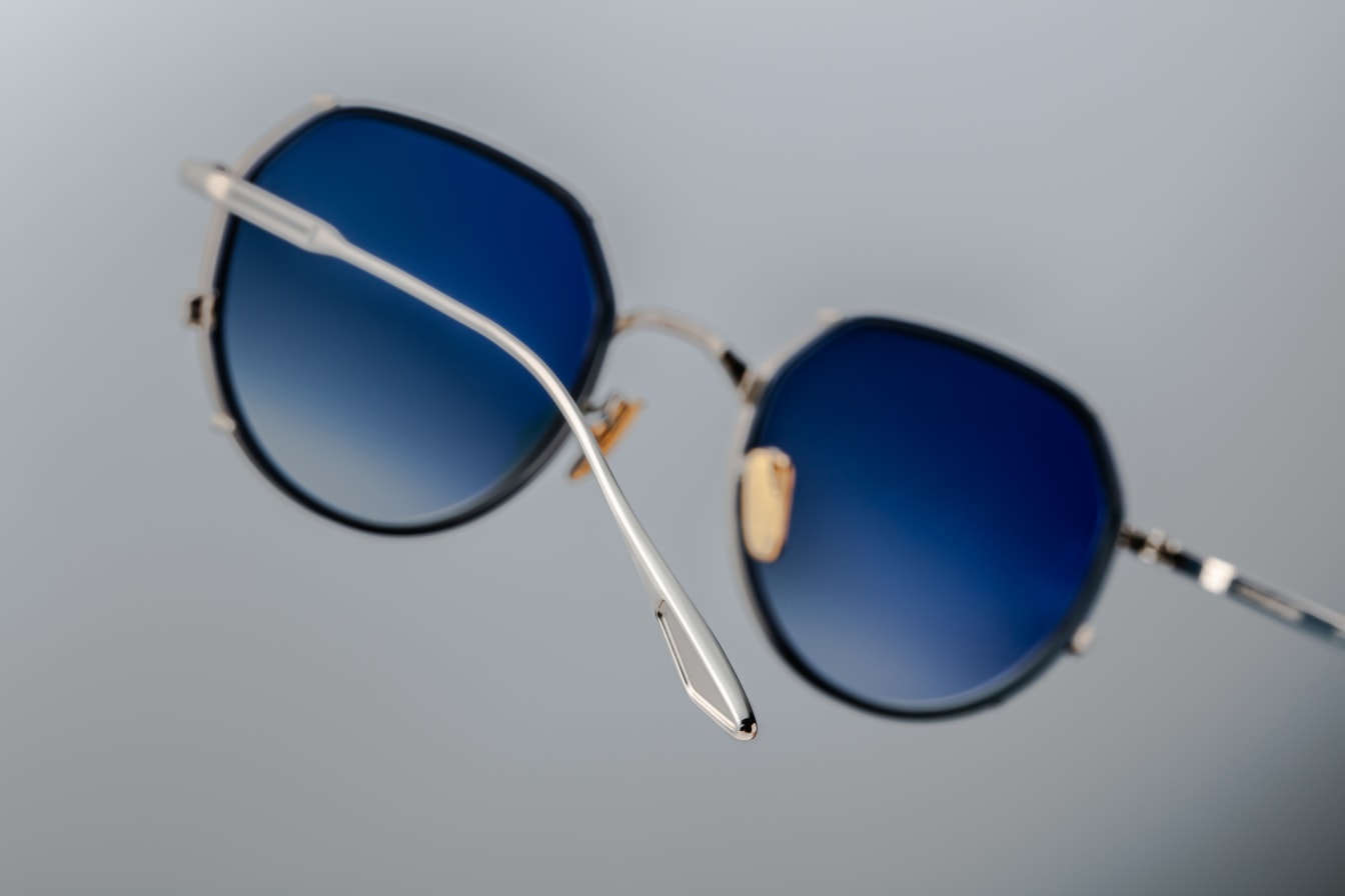 Jacques Marie Mage Hartana sunglasses in Fossil (silver with blue lenses).